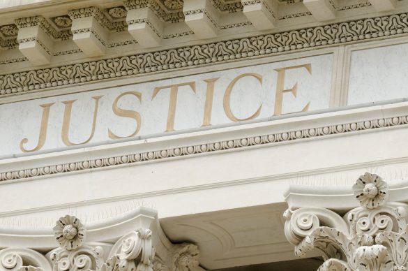 bigstock-justice-word-engraved-22201856